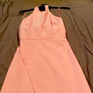 Beautiful pink halter dress with a bow on the back. Size 4. Never worn.